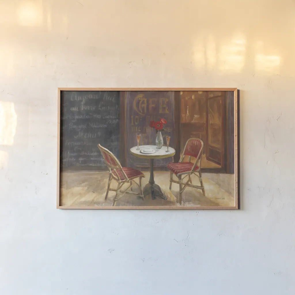 Cafe a Deux by Danhui Nai. shown as a paper print in a natural frame. Available as a archival giclee rolled canvas, fine art paper, or poster print. SKU 12348i.