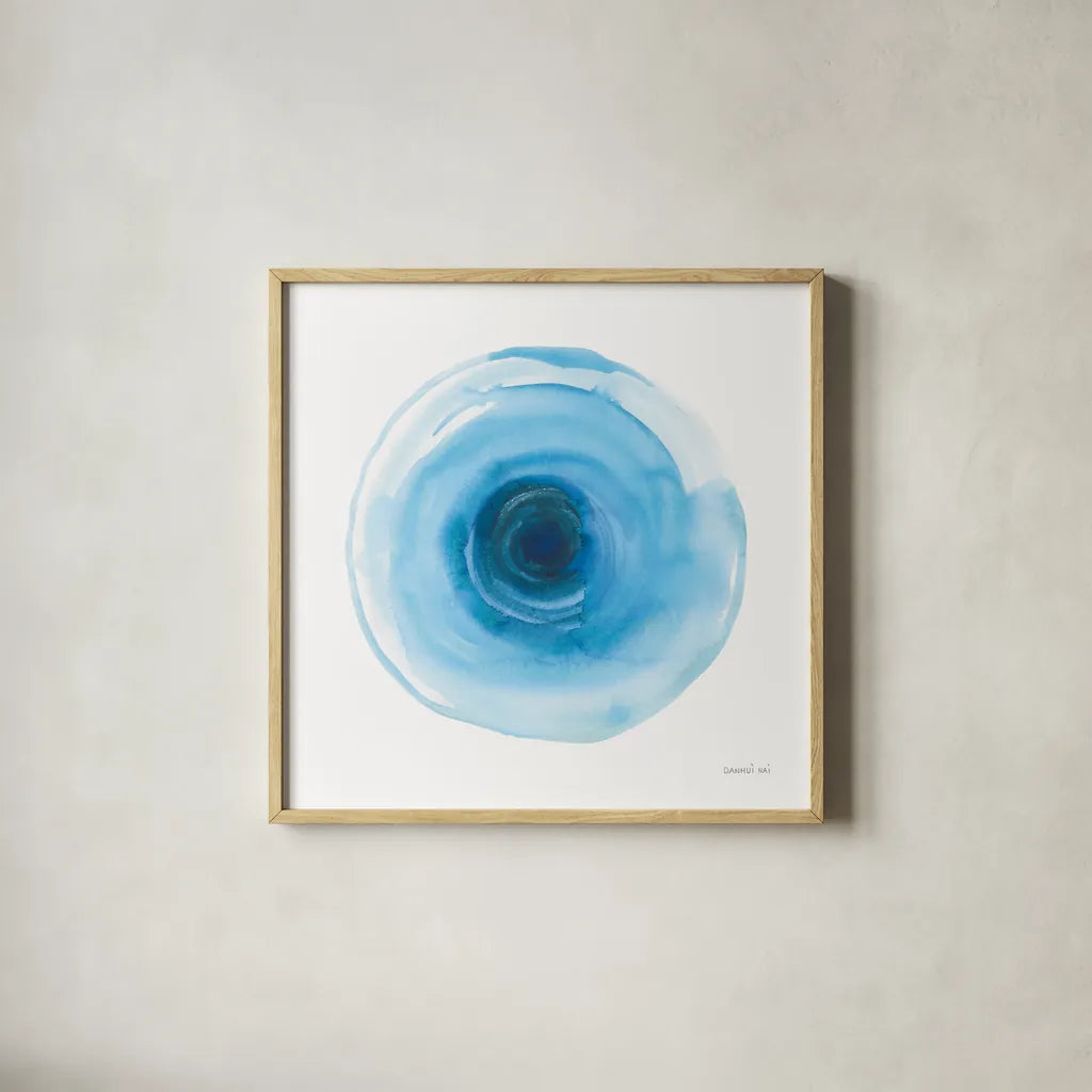 Center of Blue I by Danhui Nai. Shown in a natural wood glass frame for a timeless modern aesthetic. Available as an archival giclee rolled canvas, fine art paper, or poster print. SKU 76093a.