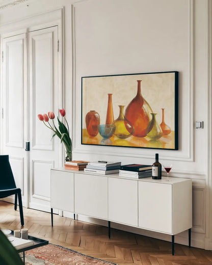 Colorful Glass Vessels on Ivory by Danhui Nai. shown as a framed stretched canvas in a living room above a console. Available as a archival giclee rolled canvas, fine art paper, or poster print. SKU 12461i.
