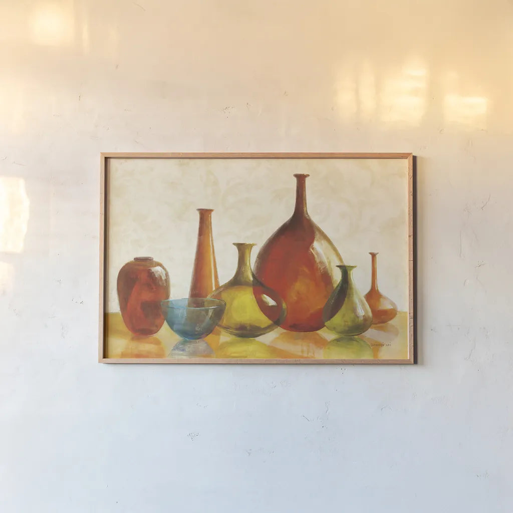 Colorful Glass Vessels on Ivory by Danhui Nai. shown as a paper print in a natural frame. Available as a archival giclee rolled canvas, fine art paper, or poster print. SKU 12461i.