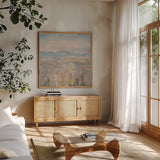 Distant Mountains by Danhui Nai. Shown in a natural wood frame in a cozy modern living room. Available as an archival giclee rolled canvas, fine art paper, or poster print. SKU 66542a.