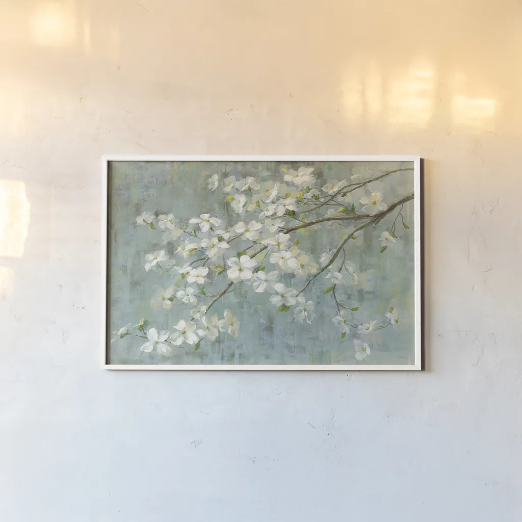 Dogwood in Spring on Blue by Danhui Nai. shown as a paper print in a white frame. Available as a archival giclee rolled canvas, fine art paper, or poster print. SKU 28719i.