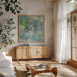 Droplets by Danhui Nai. Shown in a natural wood frame in a cozy modern living room. Available as an archival giclee rolled canvas, fine art paper, or poster print. SKU 82789a.