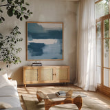 Escalante Mood Blue and White Sq by Danhui Nai. Shown in a natural wood frame in a cozy modern living room. Available as an archival giclee rolled canvas, fine art paper, or poster print. SKU 77485a.