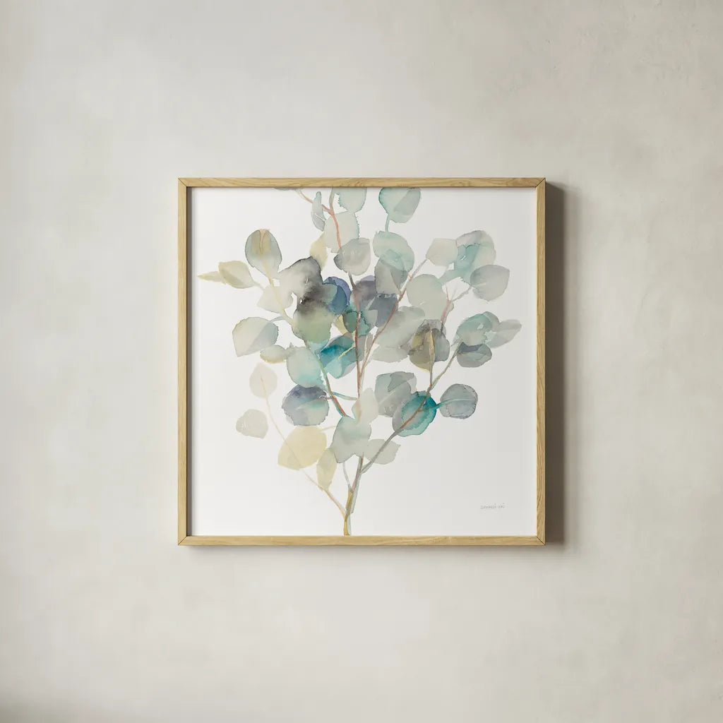 Eucalyptus III White Crop by Danhui Nai. Shown in a natural wood glass frame for a timeless modern aesthetic. Available as an archival giclee rolled canvas, fine art paper, or poster print. SKU 35491a.