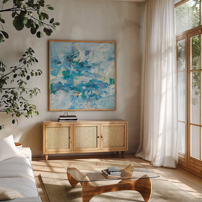 Exuding Summer Blue by Danhui Nai. Shown in a natural wood frame in a cozy modern living room. Available as an archival giclee rolled canvas, fine art paper, or poster print. SKU 79506a.