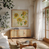 Farm Nostalgia Sunflowers by Danhui Nai. Shown in a natural wood frame in a cozy modern living room. Available as an archival giclee rolled canvas, fine art paper, or poster print. SKU 22851a.