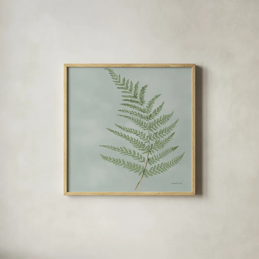 Fern II by Danhui Nai. Shown in a natural wood glass frame for a timeless modern aesthetic. Available as an archival giclee rolled canvas, fine art paper, or poster print. SKU 84103a.