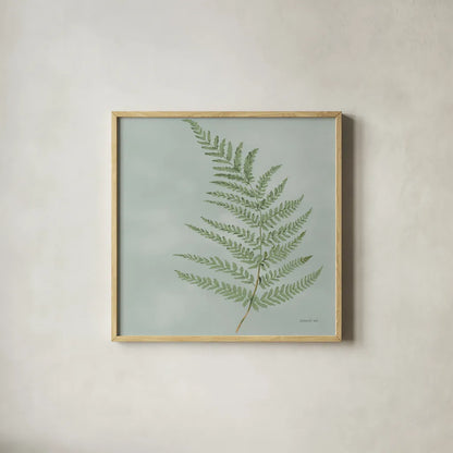 Fern II by Danhui Nai. Shown in a natural wood glass frame for a timeless modern aesthetic. Available as an archival giclee rolled canvas, fine art paper, or poster print. SKU 84103a.