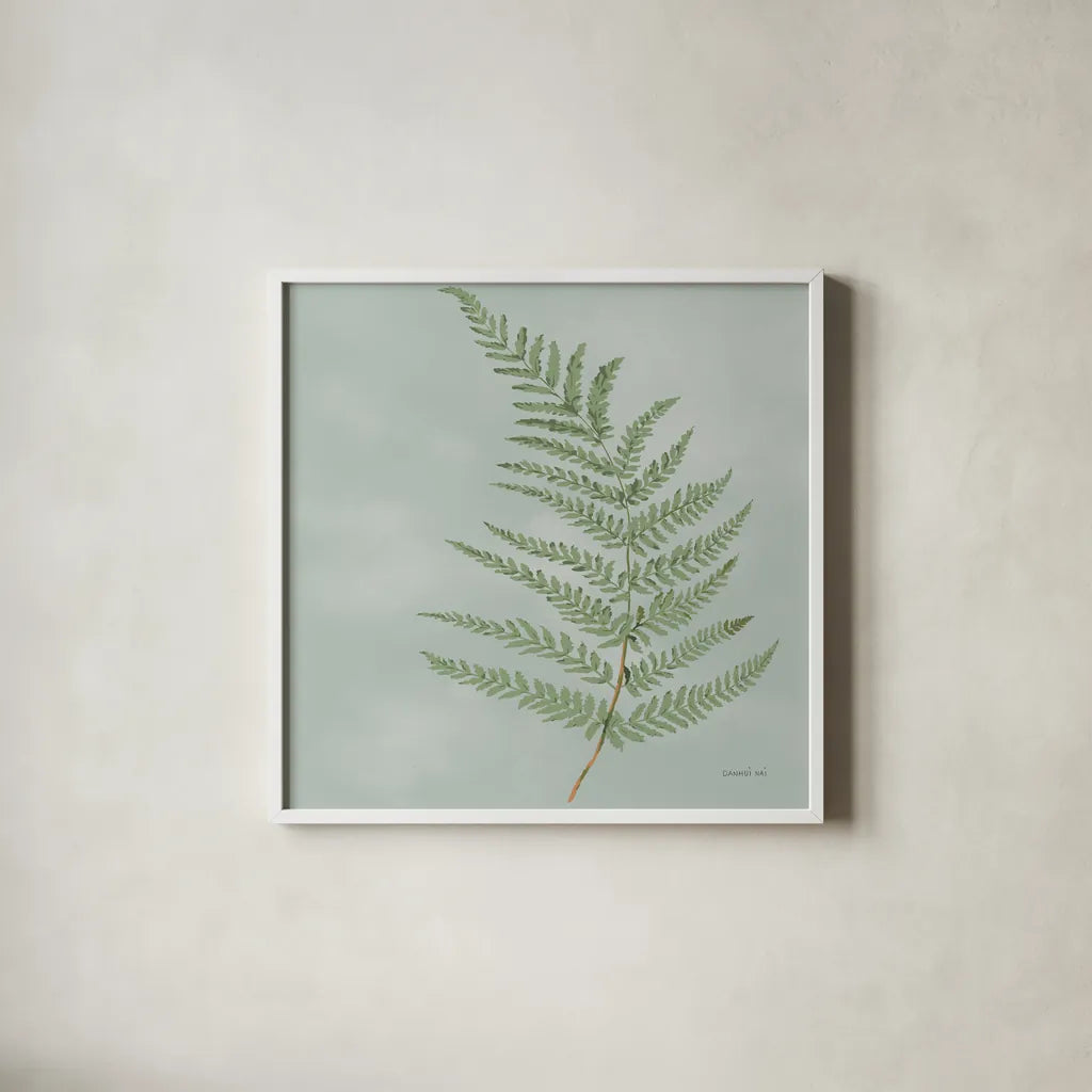 Fern II with Orange by Danhui Nai. Shown in a crisp white glass frame for a clean and minimalist style. Available as an archival giclee rolled canvas, fine art paper, or poster print. SKU 86269a.
