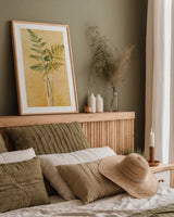 Ferns in Glass Vase I by Danhui Nai. shown as a paper print in a natural frame. Available as a archival giclee rolled canvas, fine art paper, or poster print. SKU 36561h.