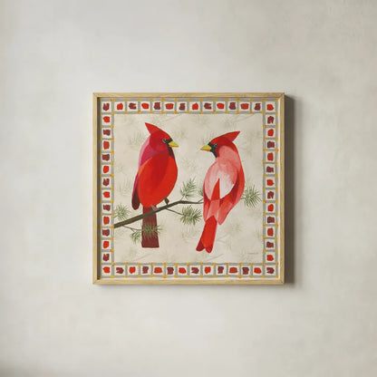 Festive Birds Two Cardinals by Danhui Nai. Shown in a natural wood glass frame for a timeless modern aesthetic. Available as an archival giclee rolled canvas, fine art paper, or poster print. SKU 21050a.
