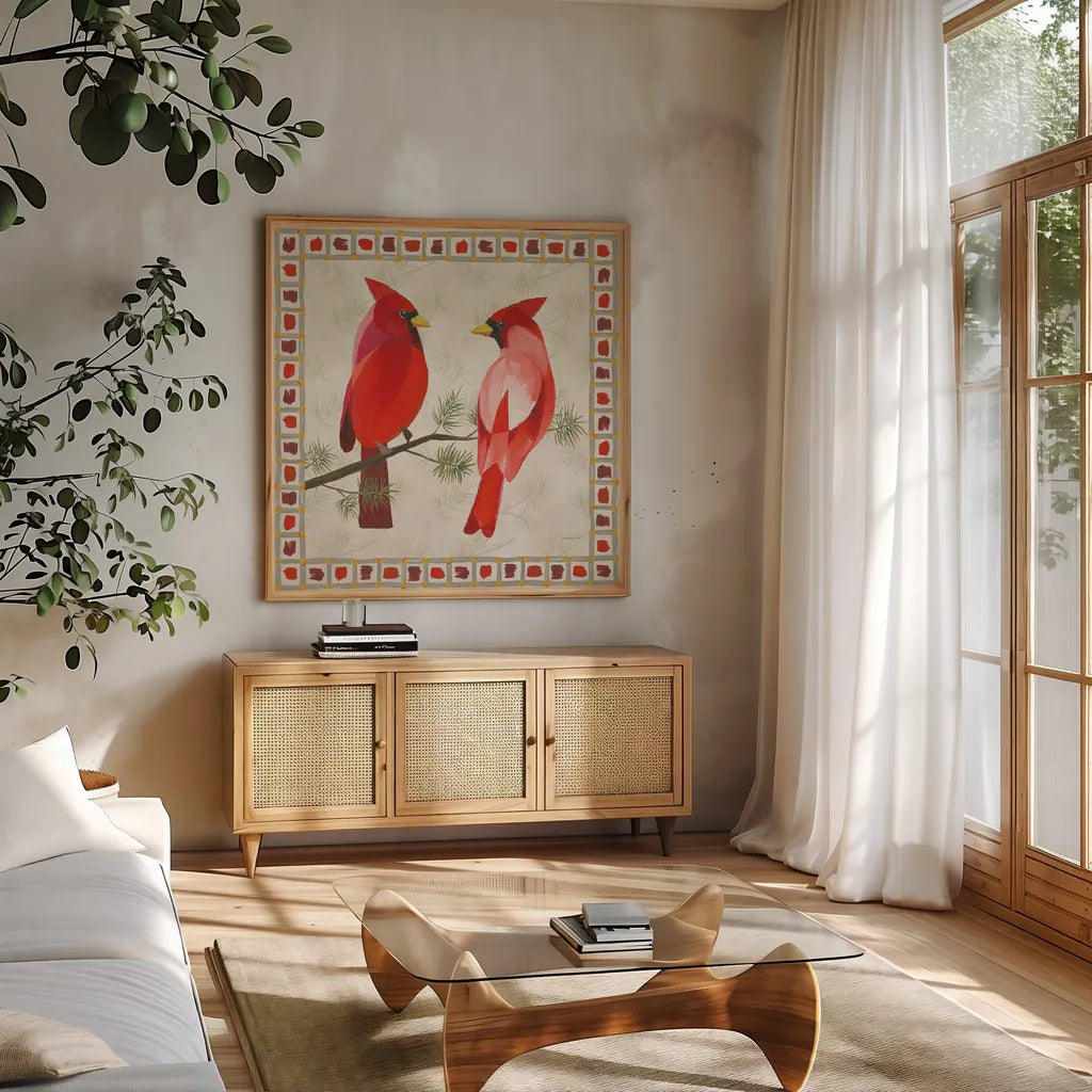 Festive Birds Two Cardinals by Danhui Nai. Shown in a natural wood frame in a cozy modern living room. Available as an archival giclee rolled canvas, fine art paper, or poster print. SKU 21050a.