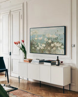 Field of Poppies Bright Cream Crop by Danhui Nai. shown as a framed stretched canvas in a living room above a console. Available as a archival giclee rolled canvas, fine art paper, or poster print. SKU 101672i.