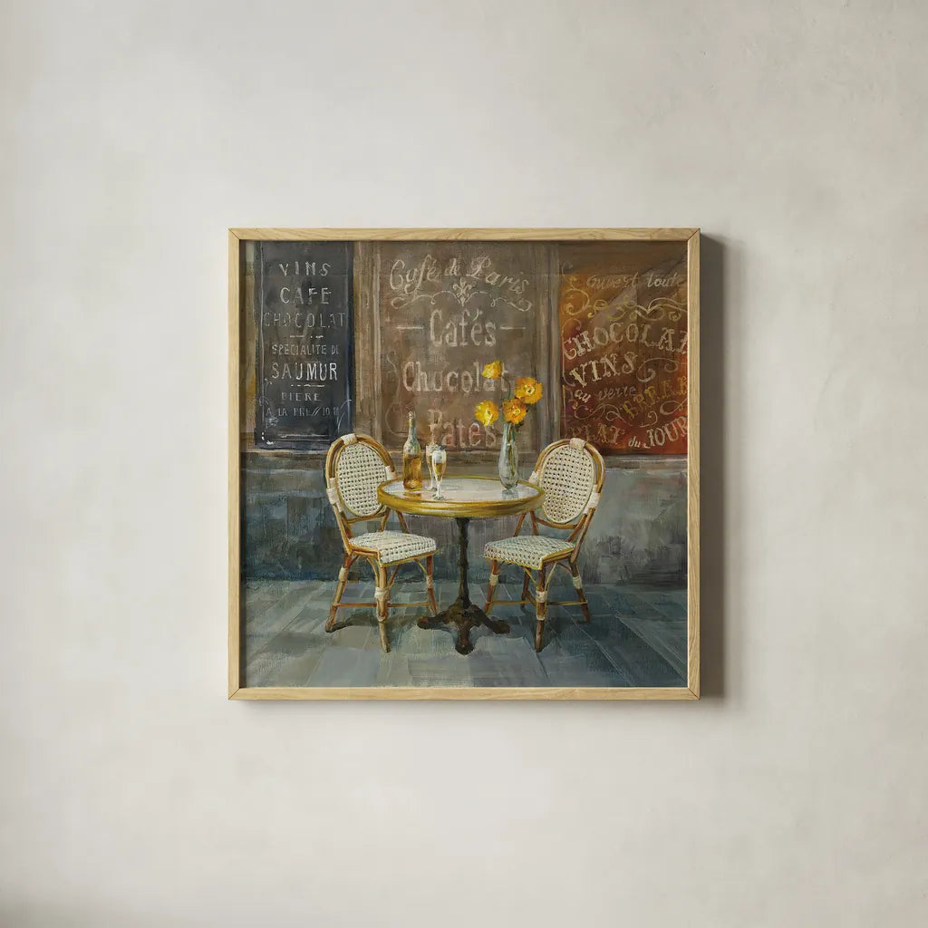 French Cafe by Danhui Nai. Shown in a natural wood glass frame for a timeless modern aesthetic. Available as an archival giclee rolled canvas, fine art paper, or poster print. SKU 25905a.