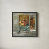 French Flowershop by Danhui Nai. Shown in a sleek black glass frame for a contemporary gallery look. Available as an archival giclee rolled canvas, fine art paper, or poster print. SKU 25906a.
