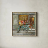 French Flowershop by Danhui Nai. Shown in a natural wood glass frame for a timeless modern aesthetic. Available as an archival giclee rolled canvas, fine art paper, or poster print. SKU 25906a.