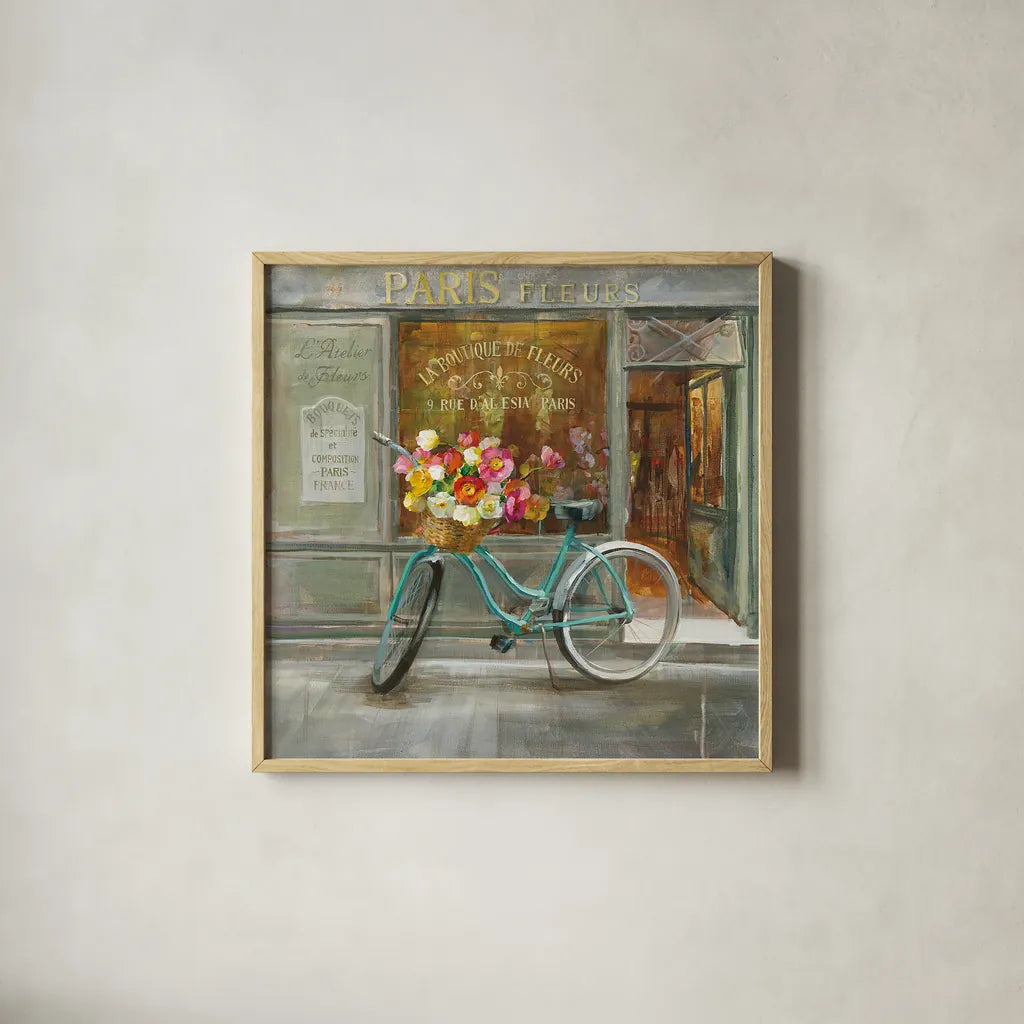 French Flowershop by Danhui Nai. Shown in a natural wood glass frame for a timeless modern aesthetic. Available as an archival giclee rolled canvas, fine art paper, or poster print. SKU 25906a.