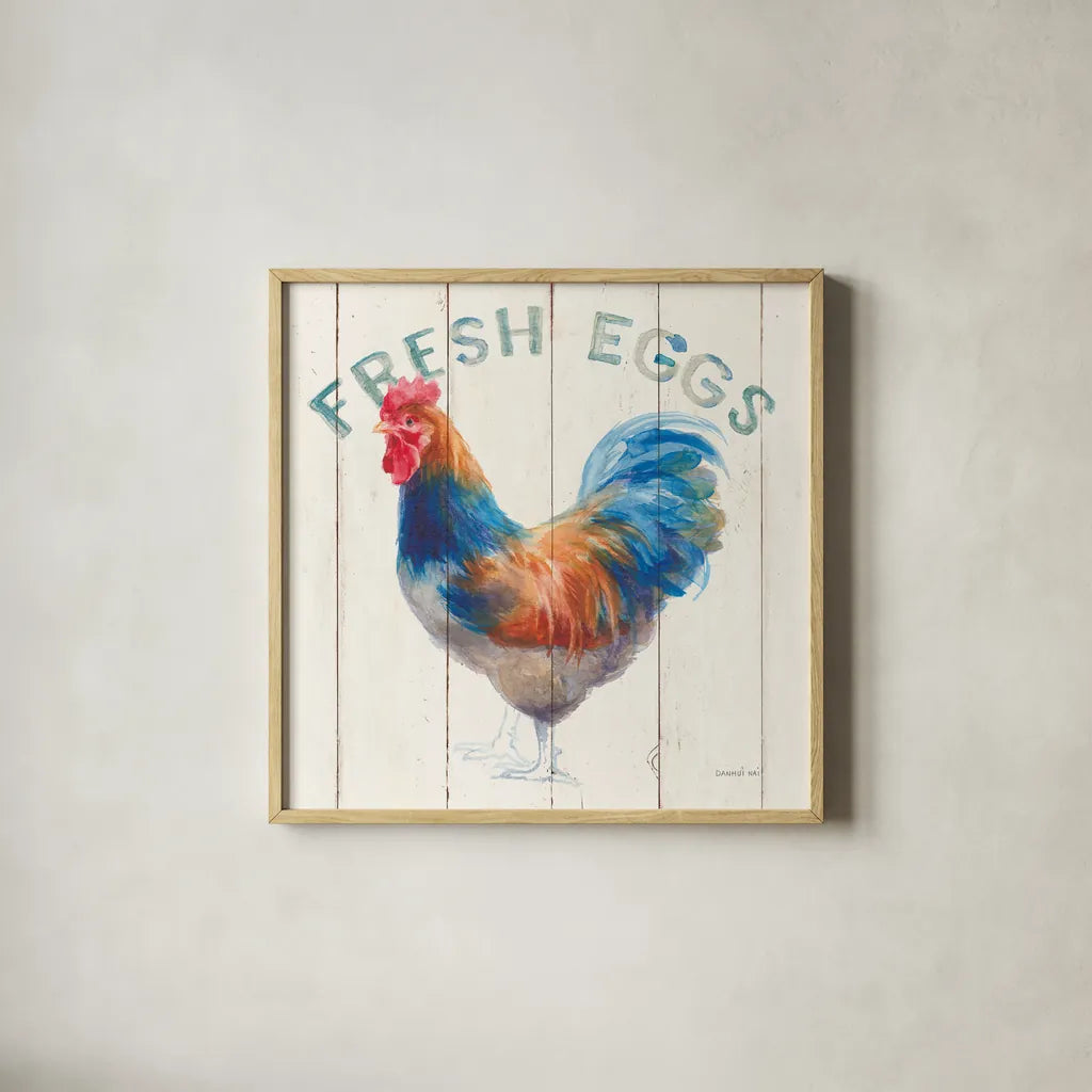 Fresh Eggs Hen by Danhui Nai. Shown in a natural wood glass frame for a timeless modern aesthetic. Available as an archival giclee rolled canvas, fine art paper, or poster print. SKU 46169a.
