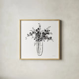 Garden Cuttings I Black by Danhui Nai. Shown in a natural wood glass frame for a timeless modern aesthetic. Available as an archival giclee rolled canvas, fine art paper, or poster print. SKU 77414a.