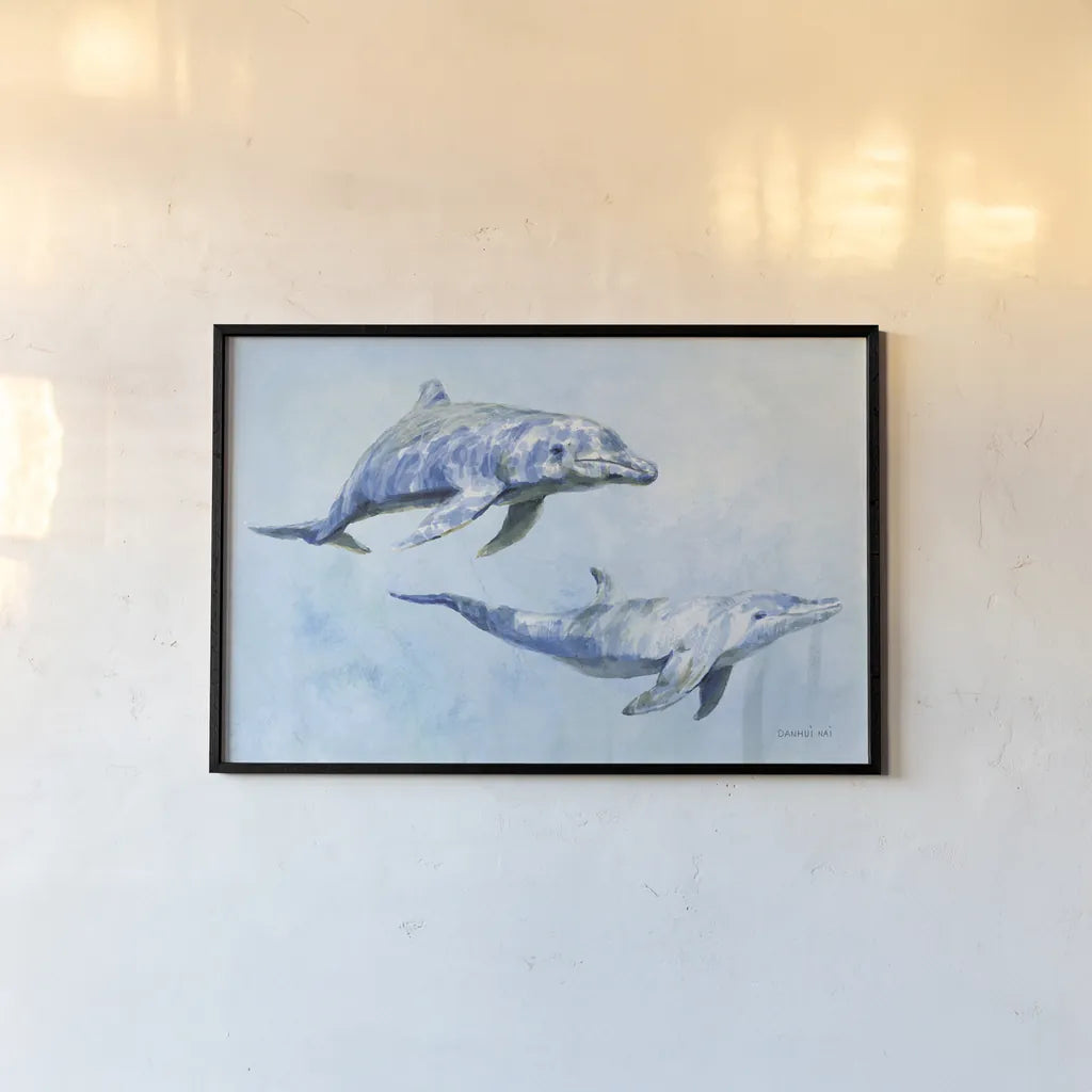 Graceful Dolphins I by Danhui Nai. shown as a paper print in a black flame. Available as a archival giclee rolled canvas, fine art paper, or poster print. SKU 93408i.