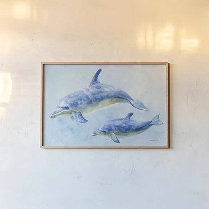 Graceful Dolphins II by Danhui Nai. shown as a paper print in a natural frame. Available as a archival giclee rolled canvas, fine art paper, or poster print. SKU 93409i.