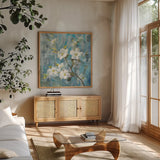 Graceful Magnolia II by Danhui Nai. Shown in a natural wood frame in a cozy modern living room. Available as an archival giclee rolled canvas, fine art paper, or poster print. SKU 91866a.