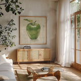 Green Apple by Danhui Nai. Shown in a natural wood frame in a cozy modern living room. Available as an archival giclee rolled canvas, fine art paper, or poster print. SKU 63851a.