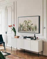 Greenhouse Orchids on Shiplap by Danhui Nai. shown as a framed stretched canvas in a living room above a console. Available as a archival giclee rolled canvas, fine art paper, or poster print. SKU 34577i.