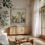 Greenhouse Orchids on Shiplap Crop by Danhui Nai. Shown in a natural wood frame in a cozy modern living room. Available as an archival giclee rolled canvas, fine art paper, or poster print. SKU 34577a.