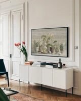 Greenhouse Orchids on Wood by Danhui Nai. shown as a framed stretched canvas in a living room above a console. Available as a archival giclee rolled canvas, fine art paper, or poster print. SKU 22021i.