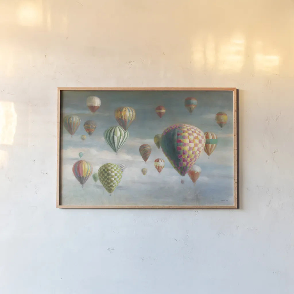 Hot Air Balloons with Pink by Danhui Nai. shown as a paper print in a natural frame. Available as a archival giclee rolled canvas, fine art paper, or poster print. SKU 47867i.