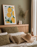Kitchen Lemons by Danhui Nai. shown as a paper print in a natural frame. Available as a archival giclee rolled canvas, fine art paper, or poster print. SKU 94981h.