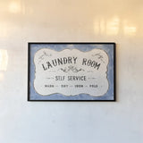 Laundry Day VII Bright Blue by Danhui Nai. shown as a paper print in a black flame. Available as a archival giclee rolled canvas, fine art paper, or poster print. SKU 75987i.