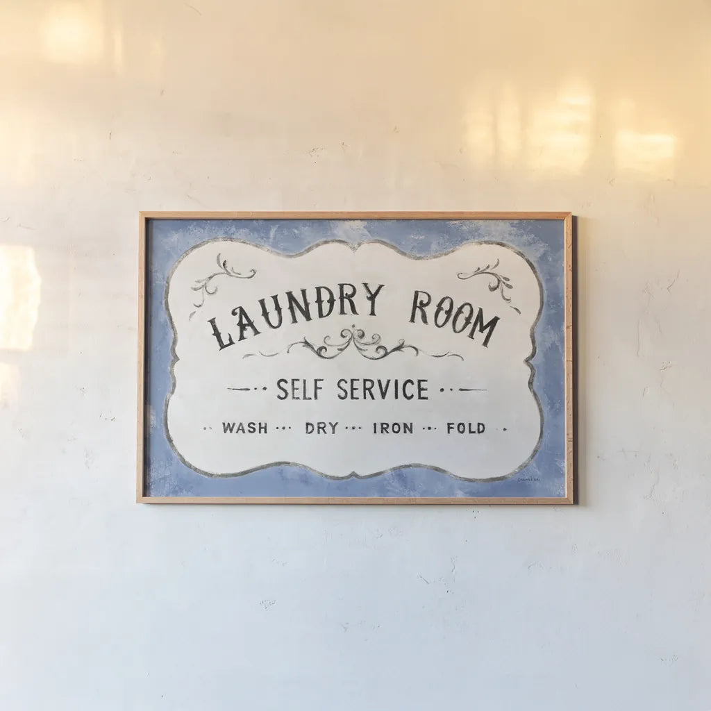 Laundry Day VII Bright Blue by Danhui Nai. shown as a paper print in a natural frame. Available as a archival giclee rolled canvas, fine art paper, or poster print. SKU 75987i.