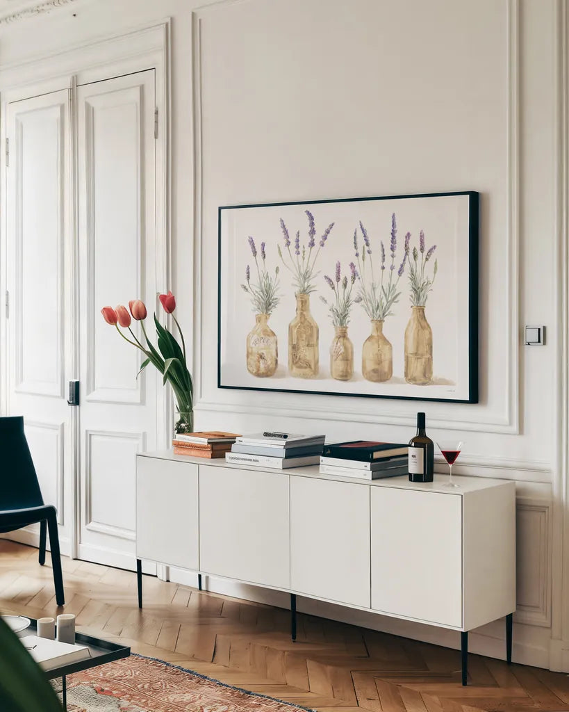 Lavender in Amber Glass by Danhui Nai. shown as a framed stretched canvas in a living room above a console. Available as a archival giclee rolled canvas, fine art paper, or poster print. SKU 82240i.