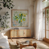 Lemon Branch by Danhui Nai. Shown in a natural wood frame in a cozy modern living room. Available as an archival giclee rolled canvas, fine art paper, or poster print. SKU 48295a.