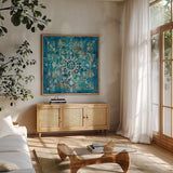 Mandala in Blue I Sq by Danhui Nai. Shown in a natural wood frame in a cozy modern living room. Available as an archival giclee rolled canvas, fine art paper, or poster print. SKU 23482a.