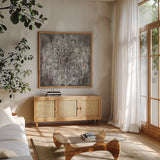 Mandala in Neutral II by Danhui Nai. Shown in a natural wood frame in a cozy modern living room. Available as an archival giclee rolled canvas, fine art paper, or poster print. SKU 26480a.