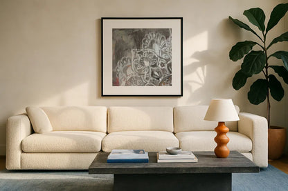 Mandala in Neutral II Sq I by Danhui Nai. Displayed in a glass frame with matte in a clean modern living room. Available as an archival giclee rolled canvas, fine art paper, or poster print. SKU 28147a.