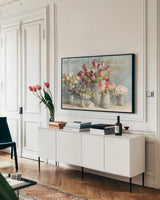 Marche des Fleurs Blue Gold by Danhui Nai. shown as a framed stretched canvas in a living room above a console. Available as a archival giclee rolled canvas, fine art paper, or poster print. SKU 19047i.