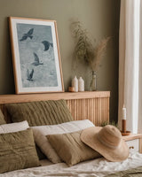 Migration Blue Panel I by Danhui Nai. shown as a paper print in a natural frame. Available as a archival giclee rolled canvas, fine art paper, or poster print. SKU 90164h.