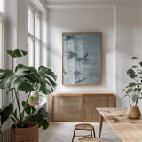 Migration Blue Panel III by Danhui Nai. shown as a print in a natural wood frame in a dining room. Available as a archival giclee rolled canvas, fine art paper, or poster print. SKU 90166h.