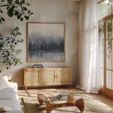 Misty Forest in Gray and Gold by Danhui Nai. Shown in a natural wood frame in a cozy modern living room. Available as an archival giclee rolled canvas, fine art paper, or poster print. SKU 88416a.