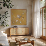 Northern Oriole on Gold by Danhui Nai. Shown in a natural wood frame in a cozy modern living room. Available as an archival giclee rolled canvas, fine art paper, or poster print. SKU 24628a.