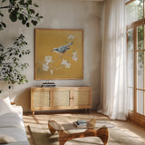 Nuthatch on Gold by Danhui Nai. Shown in a natural wood frame in a cozy modern living room. Available as an archival giclee rolled canvas, fine art paper, or poster print. SKU 24629a.