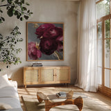 Plum Ranculus by Danhui Nai. Shown in a natural wood frame in a cozy modern living room. Available as an archival giclee rolled canvas, fine art paper, or poster print. SKU 96458a.