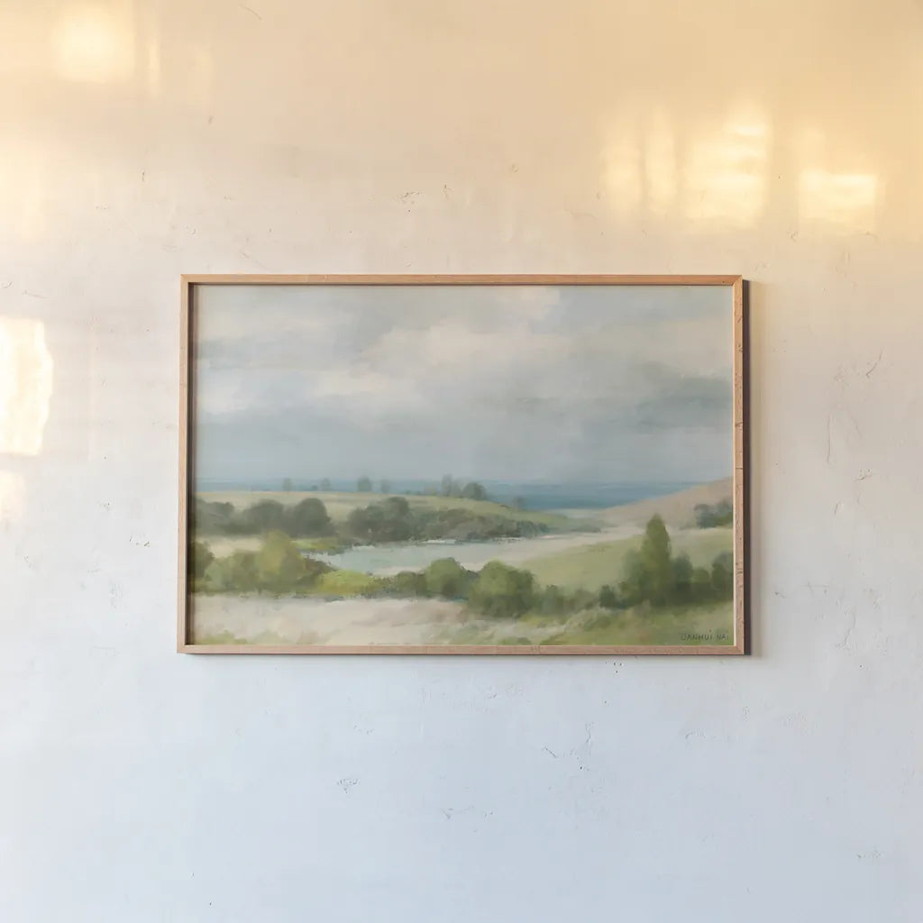 Quiet Coast by Danhui Nai. shown as a paper print in a natural frame. Available as a archival giclee rolled canvas, fine art paper, or poster print. SKU 100602i.