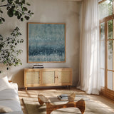 Rain Abstract III Blue Silver by Danhui Nai. Shown in a natural wood frame in a cozy modern living room. Available as an archival giclee rolled canvas, fine art paper, or poster print. SKU 54049a.