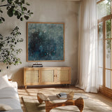 Rain in Gray and Blue by Danhui Nai. Shown in a natural wood frame in a cozy modern living room. Available as an archival giclee rolled canvas, fine art paper, or poster print. SKU 88192a.